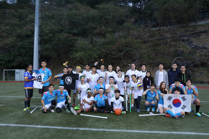 Group photo of players and helpers after the match